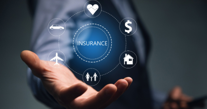 Insurance advisor handing policy document to client